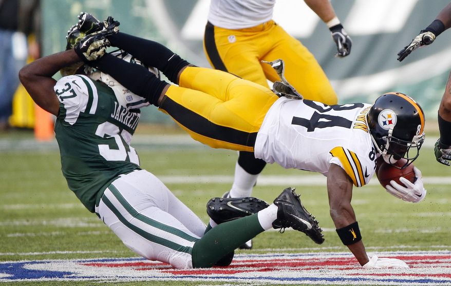 New York Jets free safety Jaiquawn Jarrett (37) tackles Pittsburgh Steelers&#39; Antonio Brown (84) during the first half of an NFL football game Sunday, Nov. 9, 2014, in East Rutherford, N.J. (AP Photo/Kathy Willens)