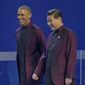 U.S. President Barack Obama, left, and Chinese President Xi Jinping walk during the Asia-Pacific Economic Cooperation (APEC) Summit family photo, Monday, Nov. 10, 2014 in Beijing. Obama is in China to attend the Asia-Pacific Economic Cooperation (APEC) Summit. (AP Photo/Pablo Martinez Monsivais)