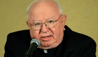 Bishop William F. Murphy acknowledges the need for the Catholic Church to find common ground with modern health care in the name of providing care. (Associated Press)