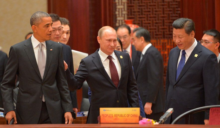 upper hand: Russian President Vladimir Putin (center) signed a natural gas agreement with Chinese President Xi Jinping, but President Obama is still working on a deal. (RIA Novosti via Associated Press)