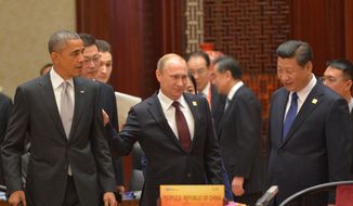 President Obama, Russian President Vladimir Putin and Chinese President Xi Jinping at the Asia-Pacific Economic Cooperation (APEC) Summit on Nov. 11, 2014, in Beijing. (AP Photo/RIA Novosti, Presidential Press Service)