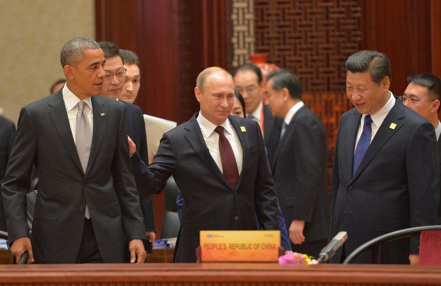 President Obama, Russian President Vladimir Putin and Chinese President Xi Jinping at the Asia-Pacific Economic Cooperation (APEC) Summit on Nov. 11, 2014, in Beijing. (AP Photo/RIA Novosti, Presidential Press Service)