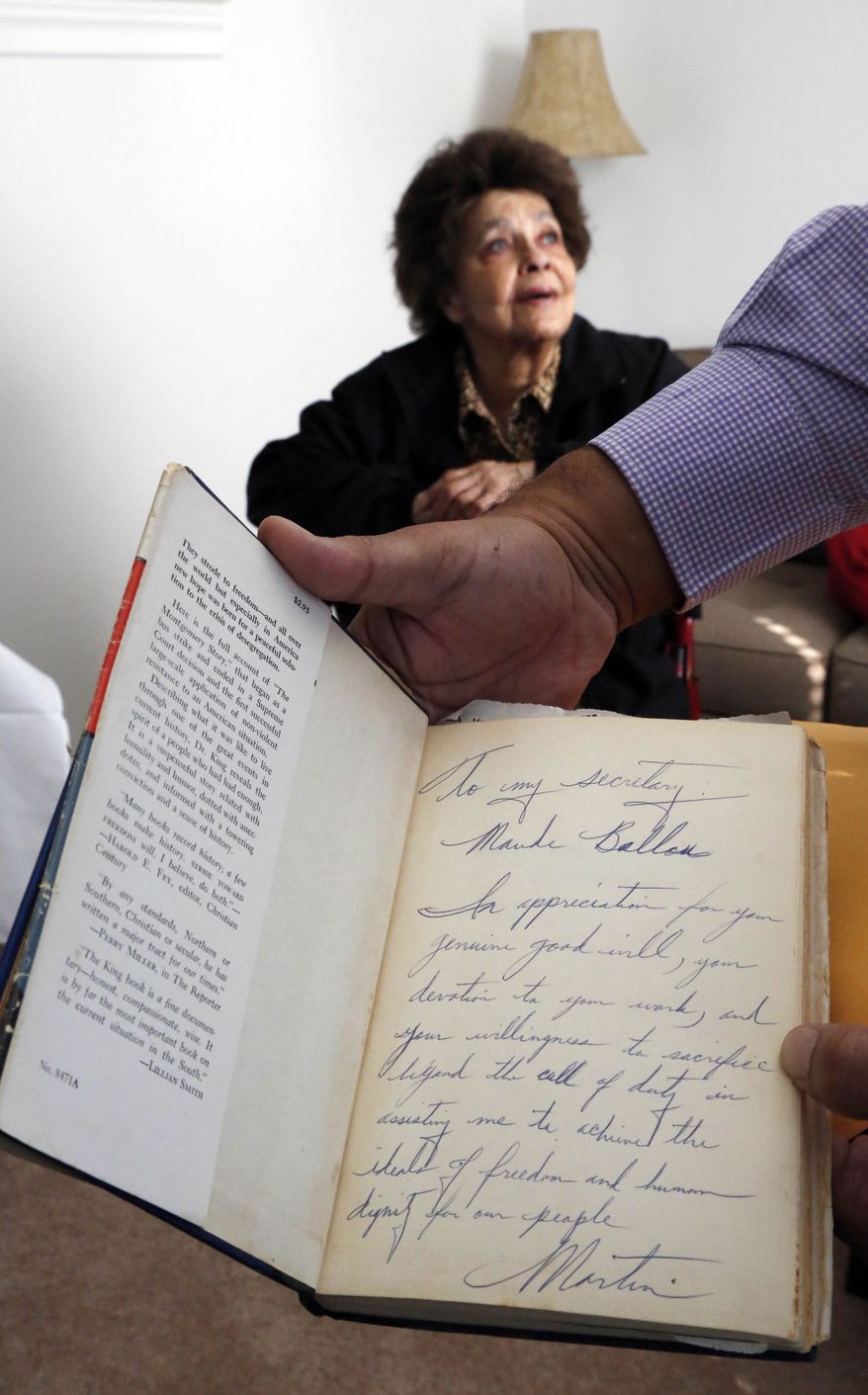 "Protest courageously, and yet with dignity and Christian love," urged Martin Luther King, Jr. in his Montgomery bus boycott memoir "Stride Toward Freedom." Above: A dedicated copy of the book. (AP Photo/Rogelio V. Solis)