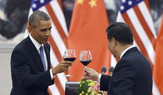 President Obama toasts with Chinese President Xi Jinping at a lunch banquet in the Great Hall of the People in Beijing Wednesday, Nov. 12, 2014. Mr. Obama is on a state visit after attending the Asia-Pacific Economic Cooperation (APEC) summit. (AP Photo/Greg Baker, Pool)