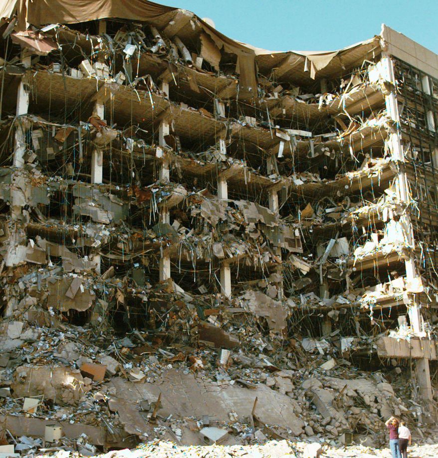 FILE - In this April 19, 1995 file photo, rescue workers stand in front of the Alfred P. Murrah Federal Building following an explosion in Oklahoma City. A federal judge in Utah admonished the FBI on Thursday, Nov. 13, 2014, for not properly investigating witness-tampering allegations against the agency after the blast, and suggested he’ll likely appoint a magistrate judge to look into the matter. The judge stopped short of finding the FBI in contempt in of court but he said he may still level sanctions against the agency at a later date. The Justice Department objected to the decision. (AP Photo/David Longstreath, File)