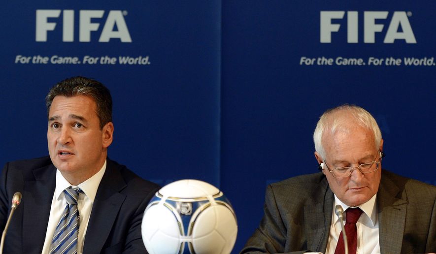FILE - In this Friday, July 27, 2012 file photo, Chairmen of the two chambers of the new FIFA Ethics Committee Michael Garcia, left, from the US and Joachim Eckert, right, from Germany attend a press conference, at the Home of FIFA in Zurich, Switzerland. FIFA ethics judge Joachim Eckert is unlikely to reach final decisions in the 2018 and 2022 World Cup bidding corruption probe until early next year.  FIFA has cleared Russia and Qatar of any wrongdoing in their winning bids for the next two World Cups. German judge Joachim Eckert formally closed FIFA’s probe into the 2018 and 2022 World Cup bidding contests on Thursday, almost four years after the vote by the governing body&#39;s scandal-tainted executive committee. Eckert noted wrongdoing among the 11 bidding nations in a 42-page summary of FIFA prosecutor Michael Garcia’s investigations. (AP Photo/Keystone, Walter Bieri, File)