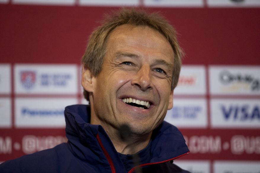 The U.S. national soccer team head coach Jurgen Klinsmann, from Germany, laughs during a press conference at Fulham&#39;s Craven Cottage stadium in London, Thursday, Nov. 13, 2014.  The U.S. are due to play Colombia in an international friendly soccer match at the stadium on Friday.  (AP Photo/Matt Dunham)