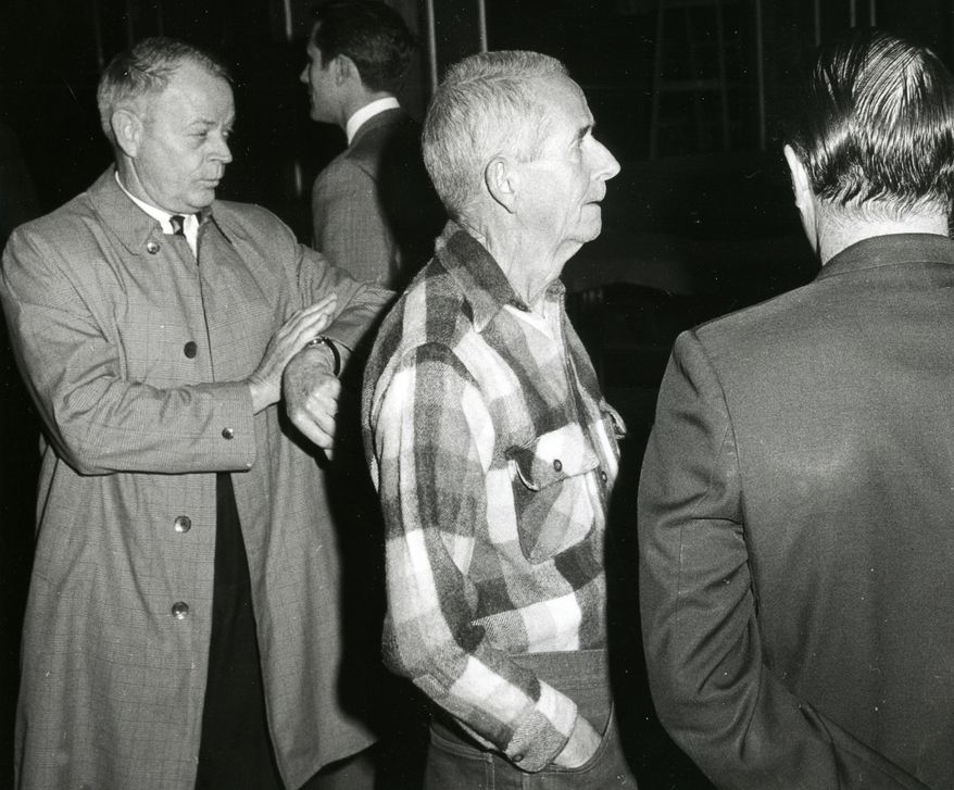 This 1969 photo shows LaVere Redfield, center, in Reno, Nev. Jack Harpster, a retired newspaperman and author of seven other books in the biography genre, has written a new book on Redfield. (AP Photo/The Reno Gazette-Journal, File)