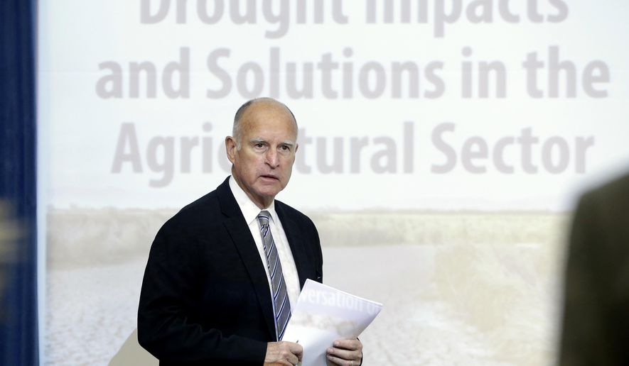 Gov. Jerry Brown enters a meeting of the Western Governors&#39; Association where a panel met to discuss the drought that has gripped California for the last three years, at the Capitol in Sacramento, Calif., Thursday Nov. 13, 2014. (AP Photo/Rich Pedroncelli)