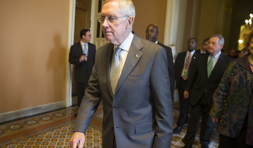 Senate Majority Leader Harry Reid of Nev. leaves a new conference on Capitol Hill in Washington, Thursday, Nov. 13, 2014, after Senate Democrats voted on leadership positions for the 114th Congress.  (AP Photo/Evan Vucci)