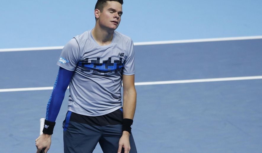 Canada’s Milos Raonic reacts in frustration after losing a point against Britain’s Andy Murray during their singles ATP World Tour tennis finals match at the O2 arena in London, Tuesday, Nov. 11, 2014. (AP Photo/Alastair Grant)
