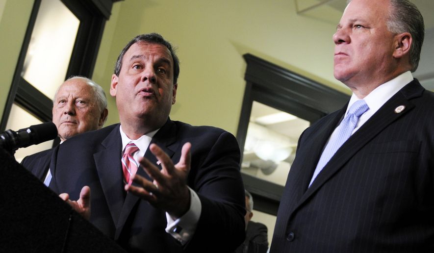 Gov. Chris Christie, center, speaks during a news conference in Atlantic City, N.J., at the end of a second summit meeting he convened Wednesday, Nov. 12, 2014, to try to resolve the resort&#39;s woes. At left is Jon Hanson, with the Advisory Commission on New Jersey Gaming, Sports and Entertainment and N.J. Senate President Steve Sweeney is at right. (AP Photo/The Philadelphia Inquirer, Tom Gralish)