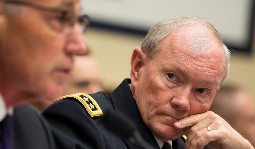 Joint Chiefs Chairman Gen. Martin Dempsey (right) listens Thursday as Defense Secretary Chuck Hagel testifies on Capitol Hill before the House Armed Services committee hearing on the Islamic State. (Associated Press)