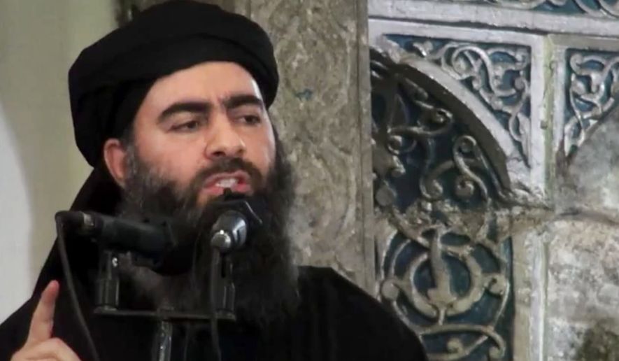 The leader of the Islamic State group, Abu Bakr al-Baghdadi, delivers a sermon at a mosque in Iraq on July 5, 2014. (Associated Press) ** FILE **