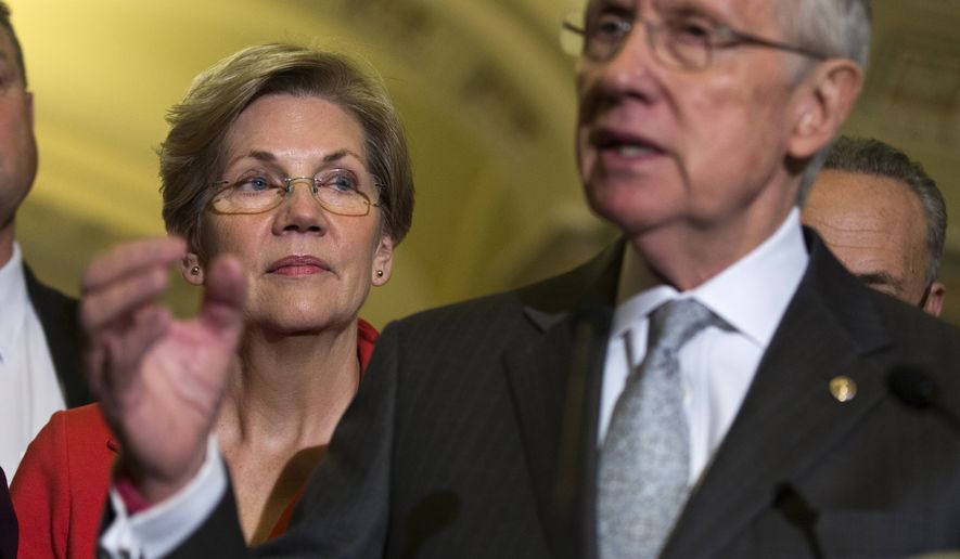 Sen. Elizabeth Warren, Massachusetts Democrat, listens at left as Senate Majority Leader Harry Reid of Nevada speaks during a news conference Thursday on Capitol Hill. (Associated Press)
