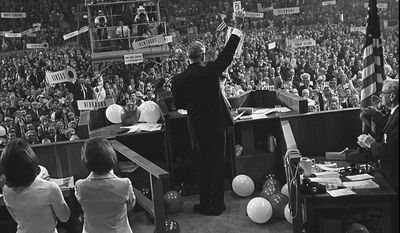 FILE - In this July 16, 1964 file photo, Barry Goldwater waves to delegates inside the Cow Palace at the Republican National Convention in San Francisco. There was a time when the Cow Palace, a cavernous exposition hall built near San Francisco&#39;s old beef slaughterhouses, was a revolving door for the country&#39;s most famous personalities. Within a span of months in 1964, the Cow Palace staged Wilt Chamberlain, the Beatles and Barry Goldwater at signature moments in their careers. But the picture is much different 46 years later. The arena aged and fell into a state of financial disarray and physical disuse. As budget woes paralyzed California lawmakers every summer, the landmark has faced threats that it would be shuttered and sold. (AP Photo/File)