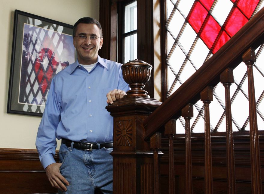 Jonathan Gruber poses in his home in Lexington, Mass., in this Feb. 8, 2011, file photo. (AP Photo/Charles Krupa, File)