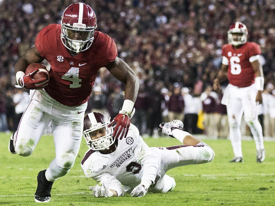 Alabama running back T.J. Yeldon (4) runs in to score a touchdown against Mississippi State defensive back Justin Cox (9) during the second half of an NCAA college football game Saturday, Nov. 15, 2014, in Tuscaloosa, Ala. Alabama won 25-20. (AP Photo/Brynn Anderson)