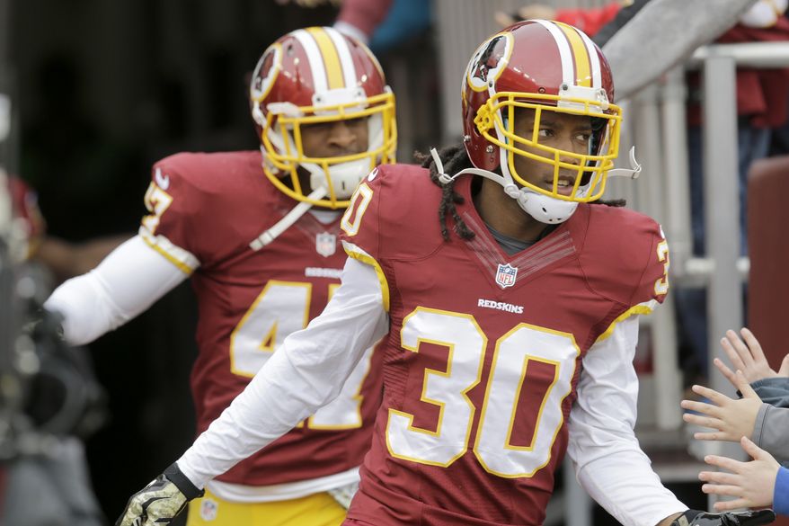 Washington Redskins free safety E.J. Biggers (30) runs onto the field before an NFL football game against the Tampa Bay Buccaneers in Landover, Md., Sunday, Nov. 16, 2014. (AP Photo/Patrick Semansky)