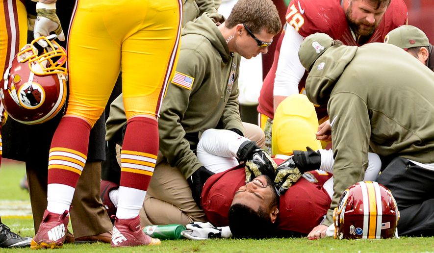 Washington Redskins tackle Trent Williams (71) leaves the game with a leg injury in the first quarter as the Washington Redskins play the Tampa Bay Buccaneers in NFL football at FedExField, Landover, Md., Sunday, November 16, 2014. (Andrew Harnik/The Washington Times)