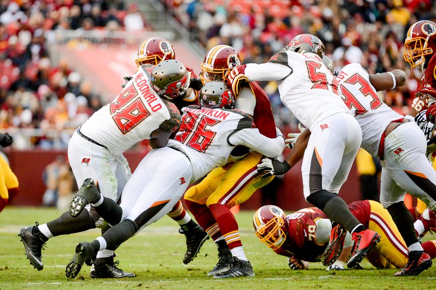 Robert Griffin III is sacked in the fourth quarter as the Washington Redskins play the Tampa Bay Buccaneers in NFL football at FedExField, Landover, Md., Sunday, November 16, 2014. (Andrew Harnik/The Washington Times)