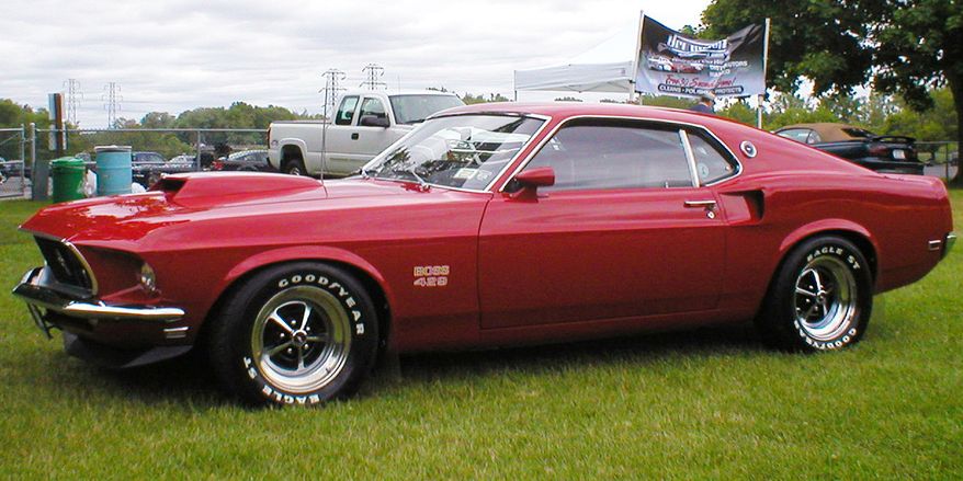 1969 FORD MUSTANG BOSS 429 - was a high performance Ford Mustang variant offered in 1969 and 1970.The Boss 429 (also known as the &#x27;Boss 9&#x27; by enthusiasts) is arguably one of the rarest and most valued muscle cars to date. In total there were 859 original Boss 429s made. The origin of the Boss 429 comes about as a result of NASCAR. Ford was seeking to develop a Hemi engine that could compete with the famed 426 Hemi from Chrysler in NASCAR&#x27;s Sprint Cup Series (then known as &quot;Grand National Division&quot;). NASCAR&#x27;s homologation rules required that at least 500 cars be fitted with this motor and sold to the general public. After much consideration, it was decided by Ford that the Mustang would be the car that would house this new engine. The Boss 429 engine was derived from the Ford 385 engine. It used four bolt mains, a forged steel crank and forged steel connecting rods. The engine featured aluminum cylinder heads, which had a modified Hemi type combustion chamber which Ford called &quot;crescent&quot;. These heads used the &quot;dry-deck&quot; method, meaning no head gaskets were used. Each cylinder, oil passage and water passage had an individual &quot;O&quot; ring style seal to seal it tight. The Boss 429 engine used a single Holley four barrel carburetor rated at 735 CFM mounted on an aluminum intake manifold that flowed well for its time. 1969 cars featured a hydraulic lifter camshaft while 1970 models got a mechanical lifter camshaft along with an improved dual exhaust system though rated power output stayed the same.