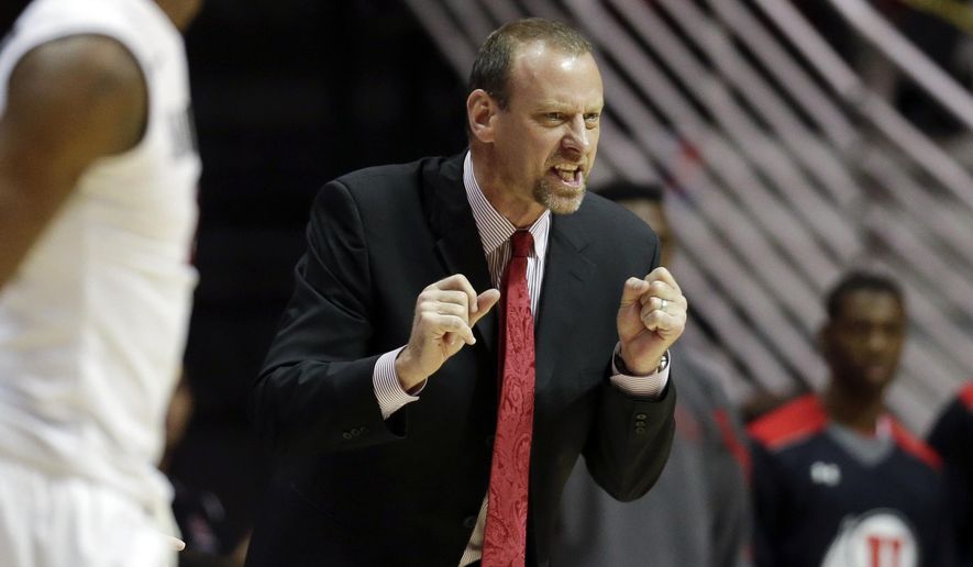 Utah head coach Larry Krystkowiak reacts as the Utes play San Diego State during the first half of an NCAA college basketball game Tuesday, Nov. 18, 2014, in San Diego. (AP Photo/Gregory Bull)