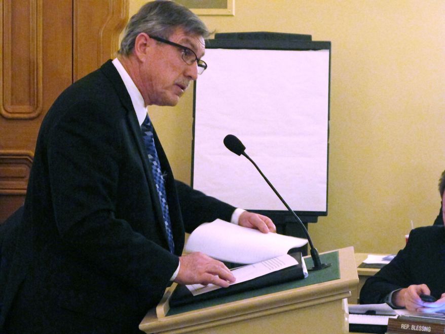 Jim Tobin, a lobbyist for the Catholic Conference of Ohio, asks lawmakers to reject a bill that would shield the source of execution drugs, on Tuesday, Nov. 18, 2014, in Columbus, Ohio. Tobin called moves to make executions more secret "a new and troubling aspect of the death penalty." (AP Photo/Andrew Welsh-Huggins)