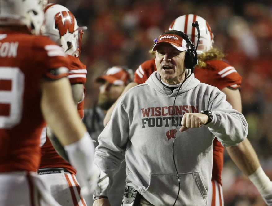 Wisconsin head coach Gary Andersen celebrates after a touchdown during the second half of an NCAA college football game against Nebraska Saturday, Nov. 15, 2014, in Madison, Wis. (AP Photo/Morry Gash)