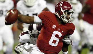 Alabama quarterback Blake Sims (6) runs with the ball away from Mississippi State linebacker Matthew Wells during the second half of an NCAA college football game on Saturday, Nov. 15, 2014, in Tuscaloosa, Ala. (AP Photo/Butch Dill)
