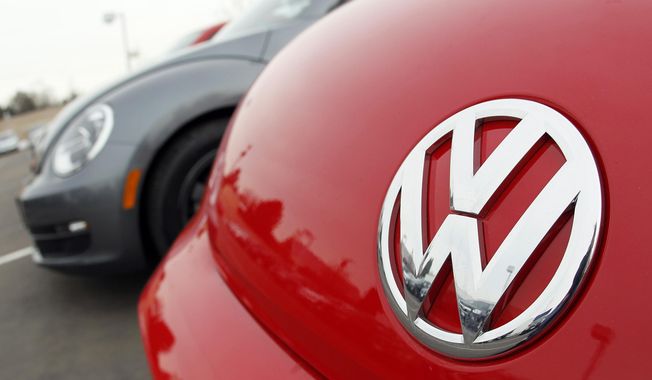 FILE - This Feb, 19, 2012 file photo shows the Volkswagen logo on the hood of a 2012 Beetle at a Volkswagen dealership in the south Denver suburb of Littleton, Colo. Volkswagen on Wednesday, Nov. 19, 2014 announced it is recalling 442,000 Jettas and Beetles to fix a problem that can cause rear suspension failure if the cars aren&#x27;t fixed properly after a crash. The recall covers 2011 through 2013 Jettas and 2012 through 2013 Beetles. (AP Photo/David Zalubowski, File)