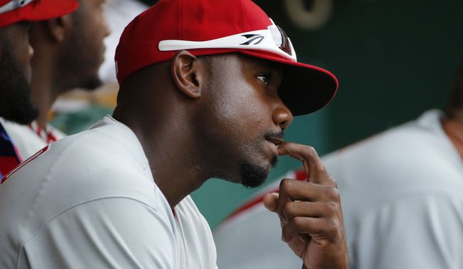 Philadelphia Phillies&#x27; Ryan Howard sits in the dugout during the ninth inning of a baseball game against the Pittsburgh Pirates in Pittsburgh Sunday, July 6, 2014. Howard had the day off. The Pirates won 6-2.(AP Photo/Gene J. Puskar)