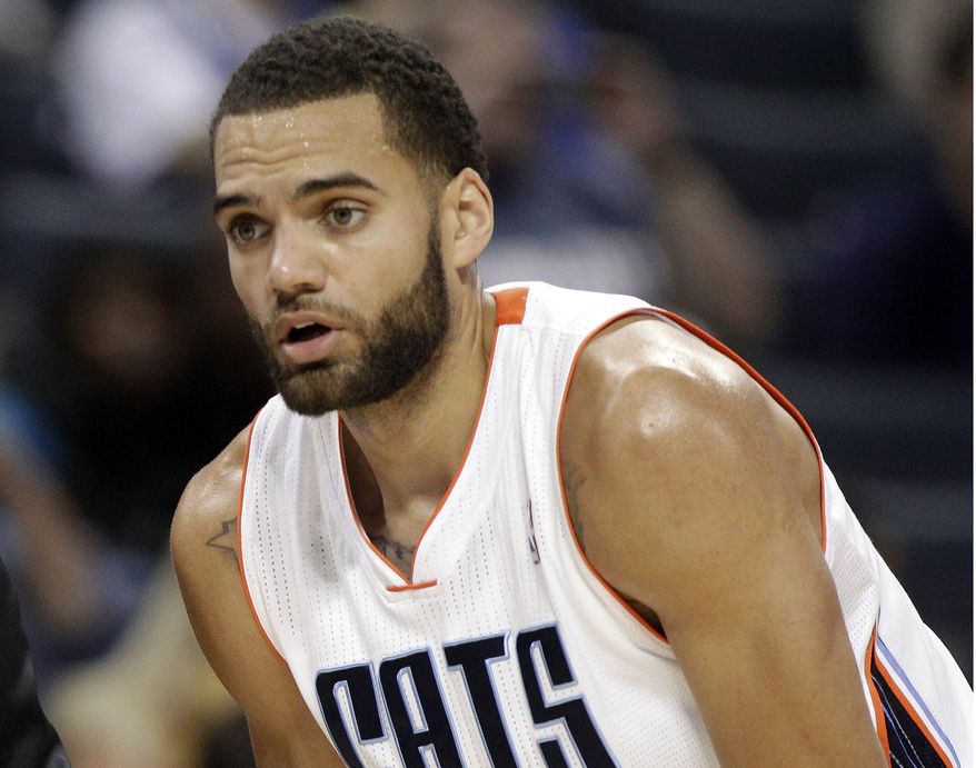 FILE - In this Nov. 10, 2012, file photo, Charlotte Bobcats Jeffery Taylor listens to his coach during the first half of an NBA basketball game against the Dallas Mavericks in Charlotte, N.C.  (AP Photo/Chuck Burton, File)