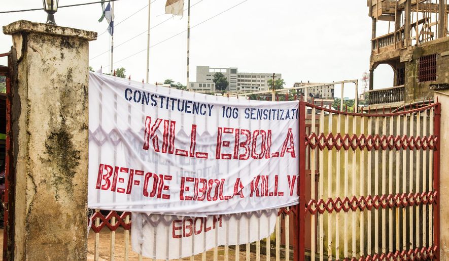 FILE- This Sept. 14, 2014, file photo shows a sign reading &#x27;Kill Ebola Before Ebola Kill You&#x27;, on a gate as part of the country&#x27;s Ebola awareness campaign in the city of  Freetown, Sierra Leone. The government&#x27;s worst-case scenario forecast for the Ebola epidemic in West Africa won&#x27;t happen, a U.S. health official said Wednesday, Nov. 19, 2014. (AP Photo/ Michael Duff, File)