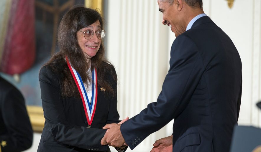 May Berenbaum, of the University of Illinois at Urbana-Champaign, shakes President Obama&#39;s hand as he awarded her the National Medal of Science during a ceremony at the White House on Thursday. The president presented this year&#39;s top national awards for science, technology and innovation. (Associated Press)