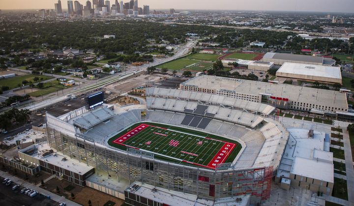This Wednesday, Aug. 20, 2014, photo, shows the new stadium at the University of Houston in Houston. The University of Houston will use powder blue alternate uniforms for its football team, reversing a previous choice to shelve the look under threat from the NFL. (AP Photo/Houston Chronicle, Karen Warren)