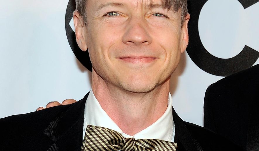FILe - In this June 8, 2014 file photo, John Cameron Mitchell arrives at the 68th annual Tony Awards in New York. Mitchell, the writer and original star of “Hedwig and the Angry Inch,” is returning to her miniskirt and wig. Mitchell said Thursday that he will take over from Michael C. Hall, the current Hedwig, in the Broadway production on Jan. 21. (Photo by Charles Sykes/Invision/AP, File)