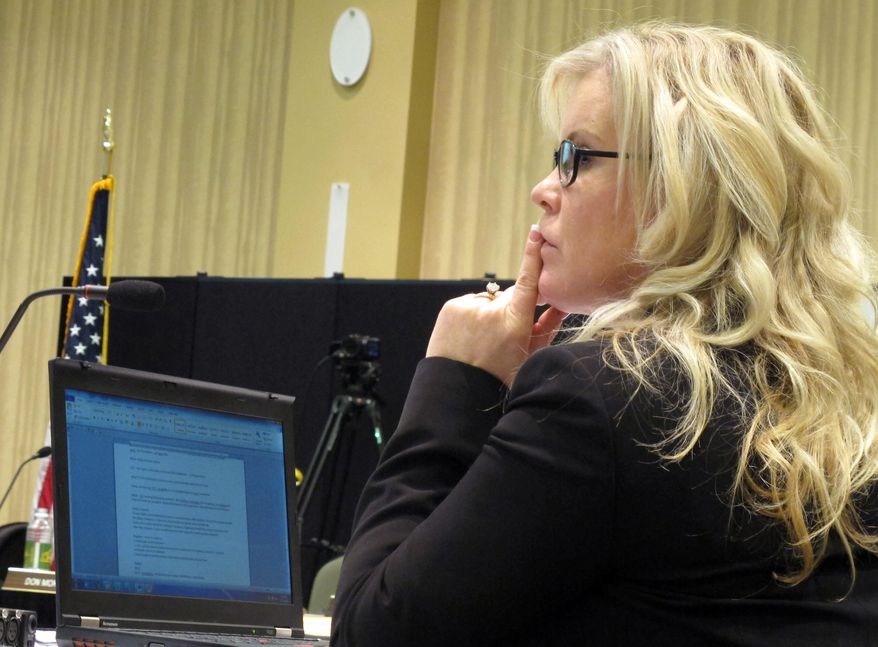 Kirsten Diederich, president of the North Dakota Board of Higher Education, listens to a discussion on admission standards during a meeting of the board Thursday, Nov. 20, 2014 at North Dakota State University in Fargo. The board voted to raise admission standards at NDSU and the University of North Dakota. (AP Photo/Dave Kolpack)