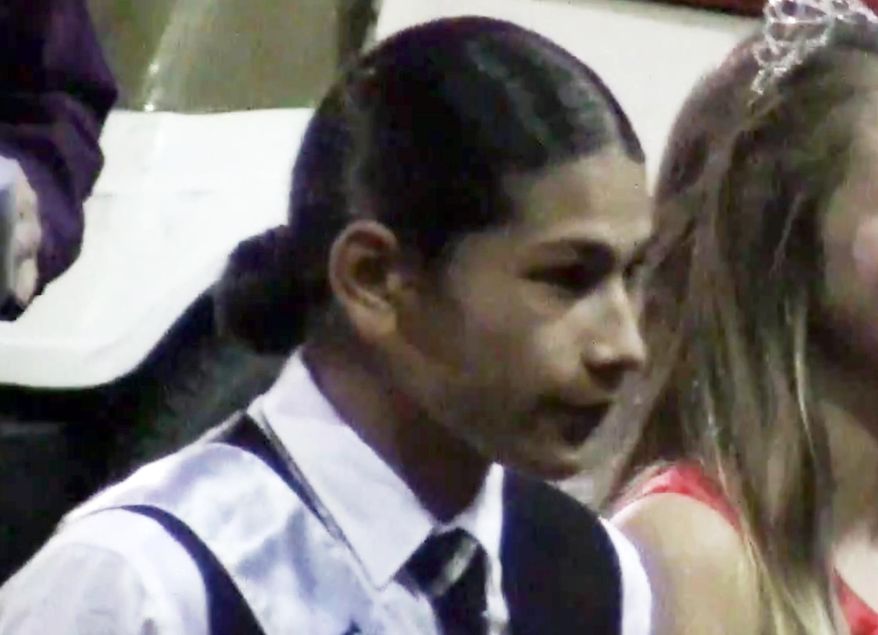 FILE - In this Oct. 17, 2014 still frame from video, student Jaylen Fryberg is seen during a homecoming celebration at Marysville-Pilchuck High School in Marysville, Wash. A detective investigating the high school shooting in Washington state that left five teens dead says in court papers seen Thursday, Nov. 20, 2014 that the young shooter's texts turned dark the week before he opened fire, with references to his funeral and the message: "Bang bang I'm dead." Moments before Jaylen Fryberg, 15, shot his fellow students Oct. 24 in the Marysville Pilchuck High School cafeteria, he texted more than a dozen relatives, describing what he wanted to wear at his funeral and who should get his personal possessions, the detective's search warrant affidavit says. (AP Photo/Jim McGauhey)