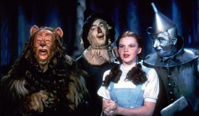 In this 1939 file photo originally released by Warner Bros., from left, Bert Lahr as the Cowardly Lion, Ray Bolger as the Scarecrow, Judy Garland as Dorothy, and Jack Haley as the Tin Woodman, are shown in a scene from &quot;The Wizard of Oz.&quot; (AP Photo/Warner Bros., file) ** FILE **