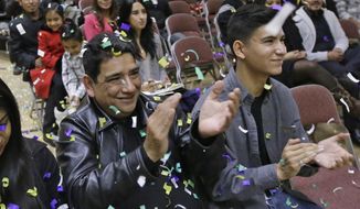 Following President Barack Obama&#39;s nationally televised address, Serafin Bahena celebrates with others at Centro Civico Mexicano, Thursday, Nov. 20, 2014, in Salt Lake City. (AP Photo/Rick Bowmer)