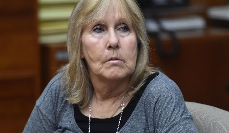 FILE-This Oct. 24, 2014 file photo shows Susan Mellen sits in Torrance Superior Court in Torrance, Calif. Mellen who spent 17 years in a California prison for a murder she didn't commit was declared factually innocent Friday, Nov. 21, 2014 clearing the way for her to collect about $600,000 in compensation from the state. (AP Photo/The Daily Breeze, Brad Graverson,File) MAGS OUT; NO SALES