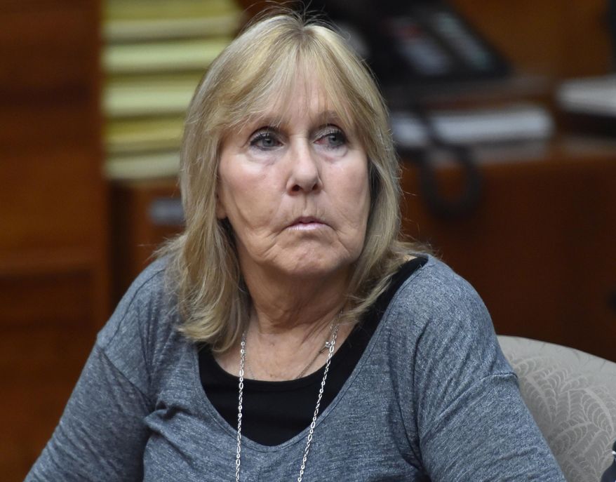 FILE-This Oct. 24, 2014 file photo shows Susan Mellen sits in Torrance Superior Court in Torrance, Calif. Mellen who spent 17 years in a California prison for a murder she didn't commit was declared factually innocent Friday, Nov. 21, 2014 clearing the way for her to collect about $600,000 in compensation from the state. (AP Photo/The Daily Breeze, Brad Graverson,File) MAGS OUT; NO SALES