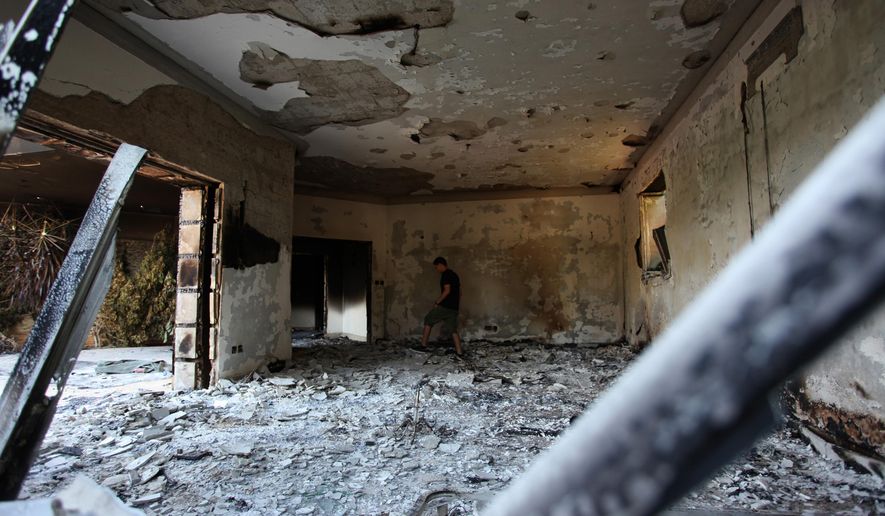 In this Sept. 13, 2012 file photo, a Libyan man walks in the rubble of the damaged  U.S. consulate, after an attack that killed four Americans, including Ambassador Chris Stevens on the night of Tuesday, Sept. 11, 2012, in Benghazi, Libya. (AP photo/Mohammad Hannon, File)
