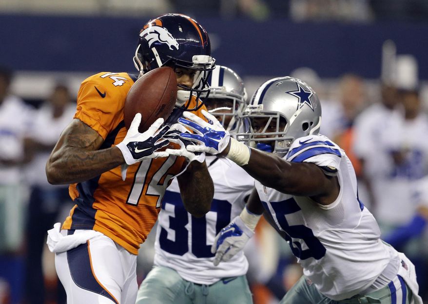 FILE - In this Aug. 28, 2014, file photo, Denver Broncos wide receiver Cody Latimer (14) grabs a pass under pressure from Dallas Cowboys cornerback Terrance Mitchell (30) and cornerback Tyler Patmon, right, in the second half of a NFL preseason football game in Arlington, Texas. Latimer says he's ready to make an impact in Denver's complex offense, and he might just get that chance Sunday against Miami with two of Peyton Manning's top targets sidelined. (AP Photo/LM Otero, File)