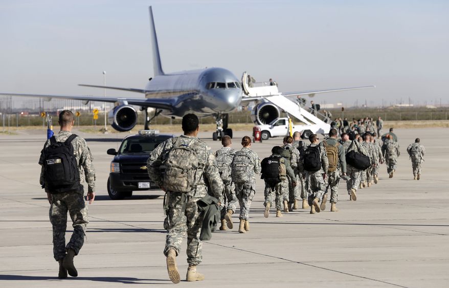 The U.S. is the "the first to respond" to "turmoil or tragedy," says Kira Davis. Above: U.S. troops depart to West Africa to facilitate air transportation to Ebola treatment units. (AP Photo/The El Paso Times, Ruben R Ramirez)