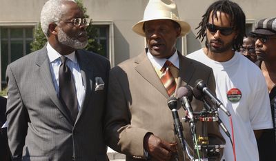 D.C. Council member Marion Barry, with his lawyer Frederick D. Cooke Jr., left, and his son, Christopher, right, speaking with reporters on June 21, 2007, after a federal judge ruled that did not violate his probation stemming from his tax problems and would not be going to jail. (Bert V. Goulait / The Washington Times)