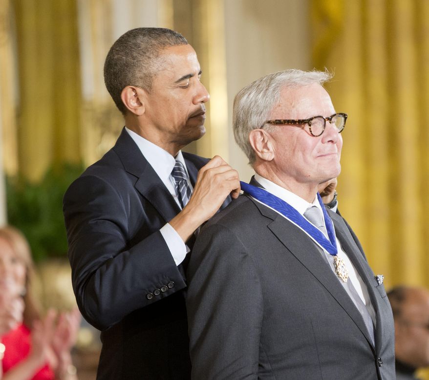 President Barack Obama awards journalist, Tom Brokaw, the Presidential Medal of Freedom, Monday, Nov. 24, 2014, during a ceremony in the East Room of the White House in Washington. (AP Photo/Pablo Martinez Monsivais)