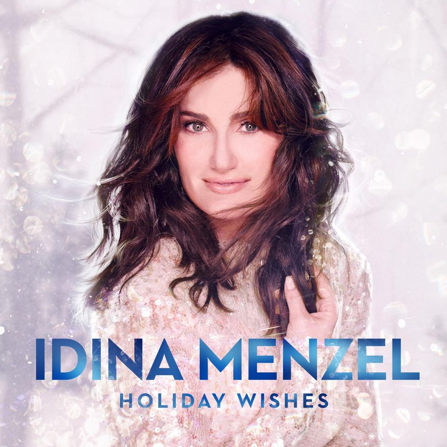 This CD cover image released by Warner Bros. Records shows "Holiday Wishes," by Idina Menzel. Menzel brings the soaring voice that made her famous this year in the Disney hit movie to her Christmas album "Holiday Wishes." The Tony Award-winner puts her own spin on holiday classics like "Silent Night" and "Do You Hear What I Hear?" (AP Photo/Warner Bros. Records)
