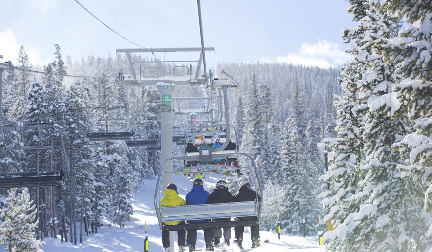 In this Nov. 16, 2014 photo provided by Keystone Resort in Keystone, Colo., skiers take a lift on a snowy mountain. A recent report commissioned by the National Ski Areas Association shows that the percentage of people with household incomes over $100,000 who participate in snow sports has risen over the past eight seasons from 45 percent of ski area visitors to 56 percent of visitors. But there are ways to make a ski trip affordable, including skiing at smaller resorts, buying multi-day, half-day and advance tickets, and taking advantage of discounts for kids, seniors and groups. (AP Photo/Keystone Resort, Cody Mendoza)